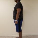 Left side view of man standing after reshape