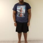 Front view of man standing up straight