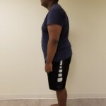 Left Side View of man standing up straight