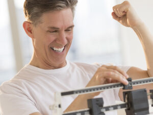 Man happy on a scale