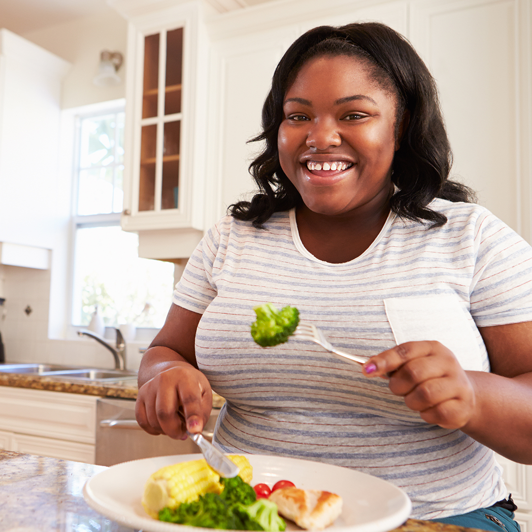 large woman eating a healthy meal