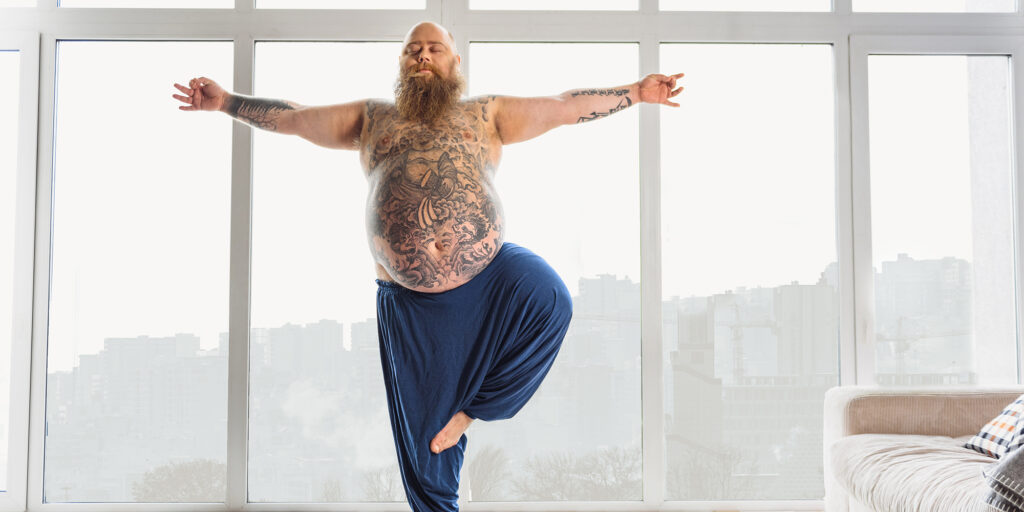 large man doing yoga