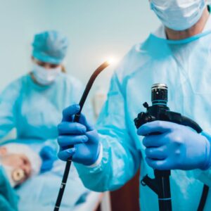Doctor holding a scope preparing to conduct a procedure. 