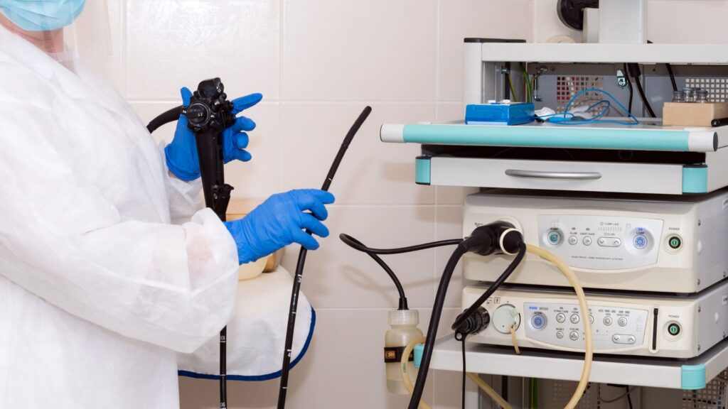 Doctor holding a colonoscopy and endoscopy scope.