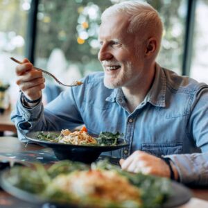 man eating a salad
