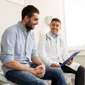 man looking at treatment options for liver condition with doctor