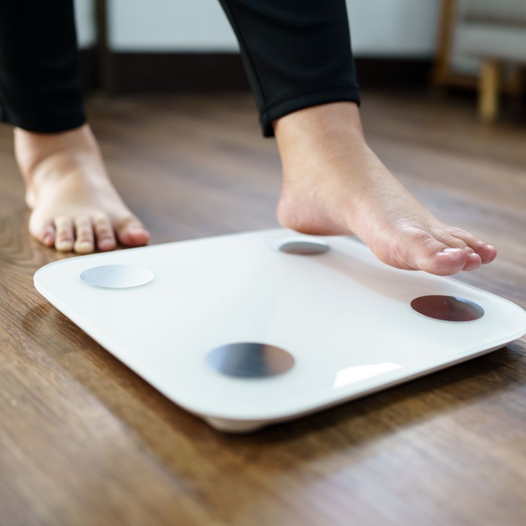 person stepping on scale