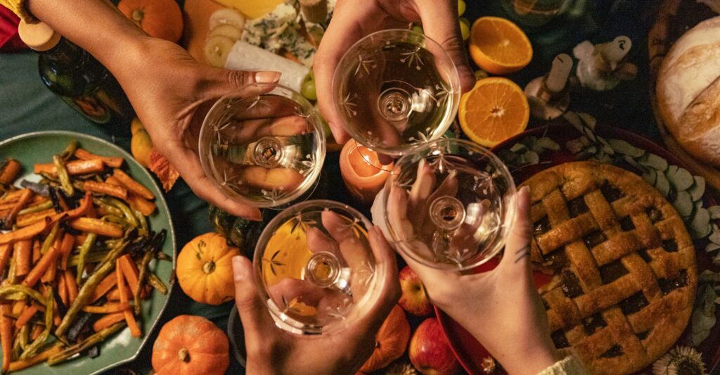 cheering drinks at Thanksgiving table