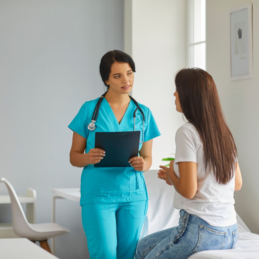 woman talking to nurse