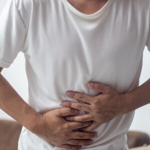 Someone clutching their liver area