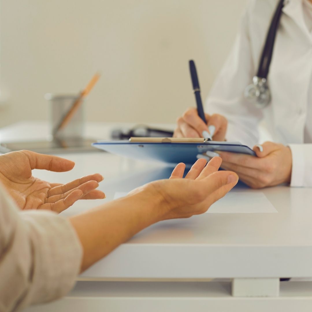person talking to a gastroenterologist