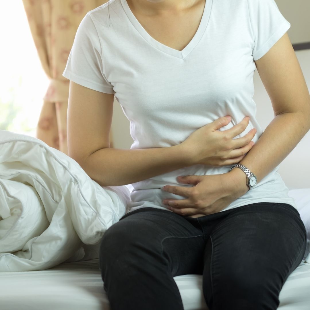 woman struggling with gastrointestinal problems