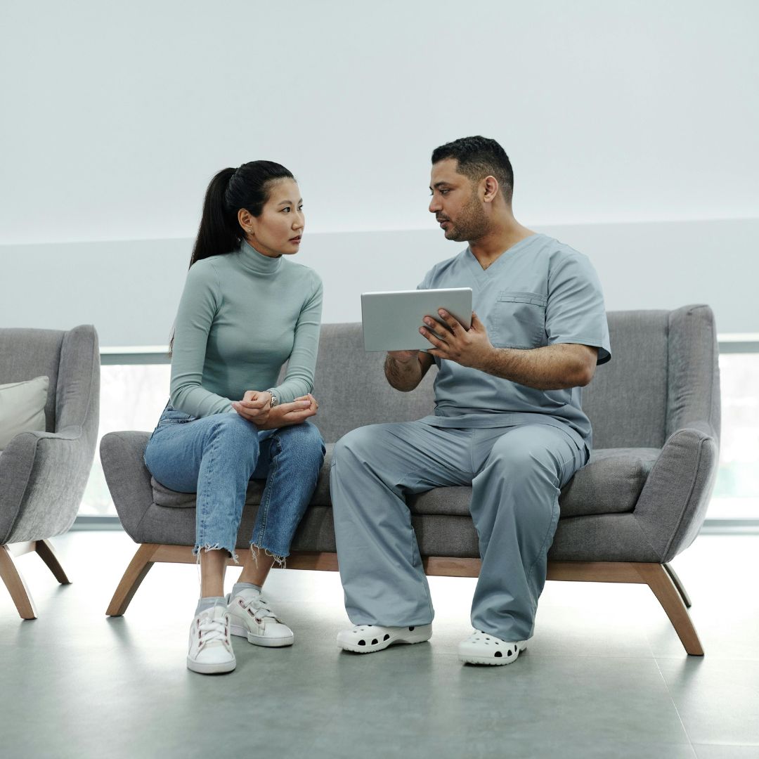 doctor sitting with patient